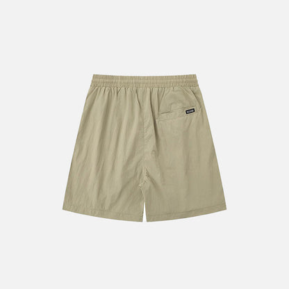 Back view of the khaki Loose Solid Color Sports Shorts in a gray background 