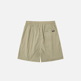 Back view of the khaki Loose Solid Color Sports Shorts in a gray background 