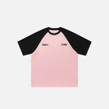 Front view of the pink Raglan Sleeve Contrast Color T-shirt in a gray background 