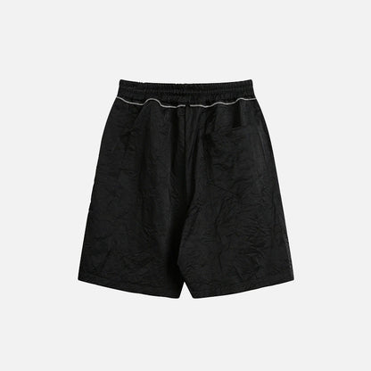 Back view of the black Basic Drawstring Shorts in a gray background