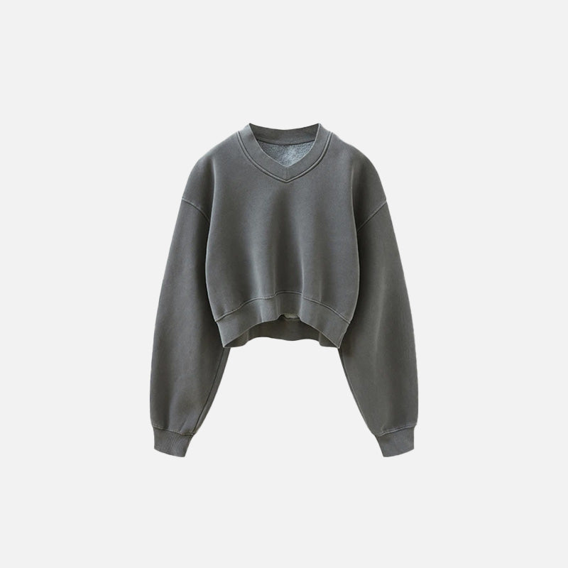 Front view of the dark grey Women's Fleece Cropped Sweatshirt in a gray background