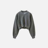 Front view of the dark grey Women's Fleece Cropped Sweatshirt in a gray background
