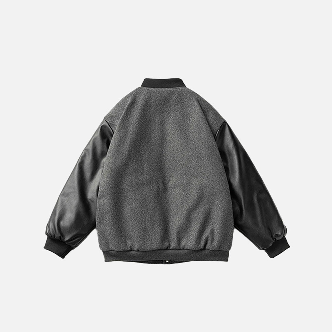Back view of the dark grey Neoism Varsity Jacket in a gray background