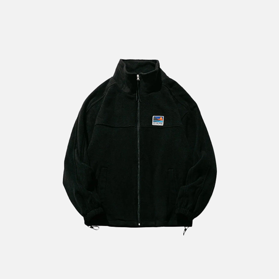 Front view of the black Urban Explorer Jacket in a gray background 