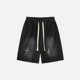 Front view of the black Relaxed Drawstring Denim Shorts in a gray background
