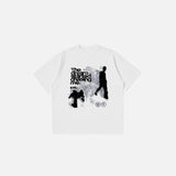 Front view of the white Dream Chaser Graphic T-shirt in a gray background
