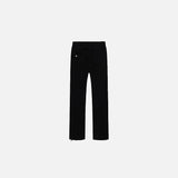 Back view of the black Timless Denim Jeans in a gray background
