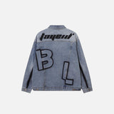 Back view of Retro Blue Washed Denim Jacket in a gray background