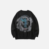 Front view of the black Angel Graphic Sweater of the gray bckground 