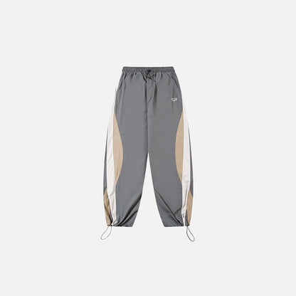 Front view of the gray Y2K Patchwork Joggers Baggy Pants in a gray background