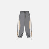 Front view of the gray Y2K Patchwork Joggers Baggy Pants in a gray background