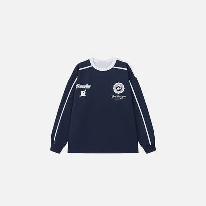 Front view of the navy blue Iconic Insignia Sweater in a gray background