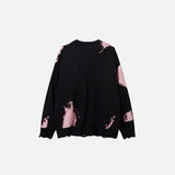 Back view of the black & pink Ragged Rebel Sweater in a gray background