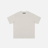 Back view of the beige The Fairy Party T-shirt in a gray background