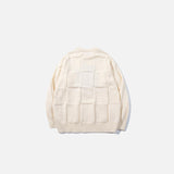 Back view of the apricot Strawberry Knit Sweater in a gray background