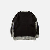 Back view of the gray Patchwork Multi Color Loose Sweater in a gray background 