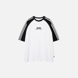 Front view of the white Loose Side Striped T-shirt in a gray background 