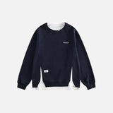Front view of the navy blue Classic Fit Sweatshirt in a gray background