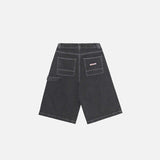 Back view of the black 90's Baggy Washed Jorts in a gray background 
