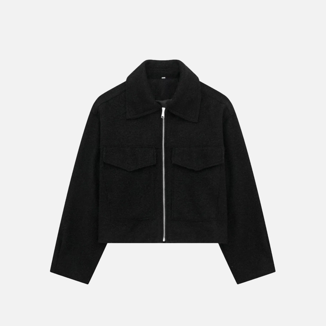 Front view of the black Quilted Utility Jacket in a gray background