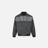 Front view of the dark gray Minimalist Humble Swag Jacket in a gray background