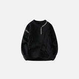 Front view of the black Ripped Stitch Sweater in a gray background