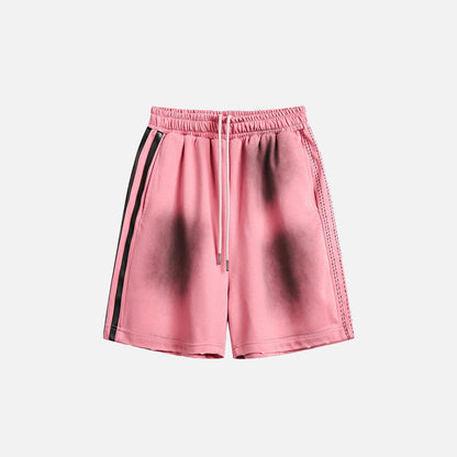 Front view of the pink Ink Jet Shorts in a gray background