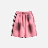 Front view of the pink Ink Jet Shorts in a gray background