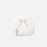 Front view of the white Bow-Knot Embellished Sweater in a gray background
