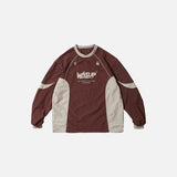 Front view of the red gray Tech Performance Pullover Sweatshirt in a gray background