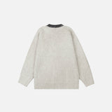 Back view of the gray Y2K Abstract Faces Sweater in a gray background