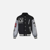 Front view of the black Patchwork Varsity Jacket in a gray background