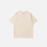Back view of the Beige The Island Graphic T-shirt in a gray background 
