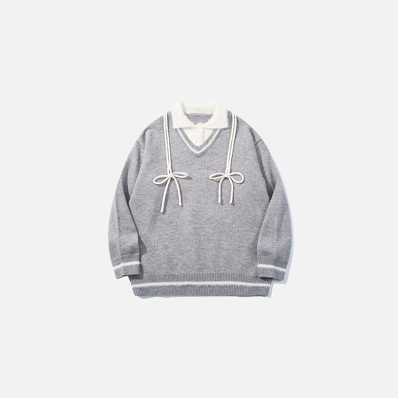 Front view of the grey Vintage Drawstring Oversized Sweater in a gray background
