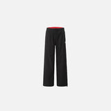 Front view of the black Classic Relaxed Fit Pants in a gray background