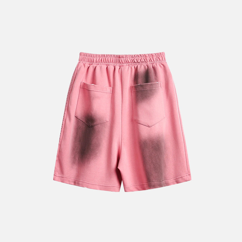 Back view of the pink Ink Jet Shorts in a gray background