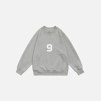 Front view of the grey Number 9 Embroidered Sweatshirt in a gray background