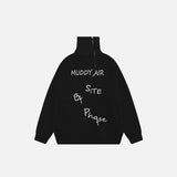 Front view of the black Y2k Letter Embroidery Oversized Sweater in a gray background 