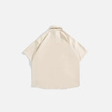Back view of the khaki Loose Retro Cargo Shirt in a gray background 