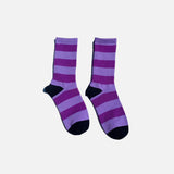 Front view of the purple Bold Stripe Crew Socks in a gray background