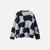 Back vew of the black Y2K Abstract Grid Knitted Sweater in a gray background