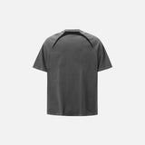 Back view of the grey Embroidery Patchwork T-shirt in a gray background