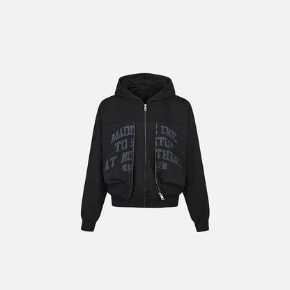 Front view of the black Motivational Zip-Up Hoodie in a gray background