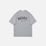 Front view of the gray Oversized Loose T-Shirt in a gray background 