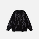 Back view of the black Loose Knitted Patches Ripped Sweater in a gray background