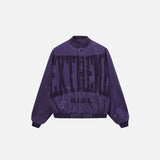 Front view of the purple Y2k Washed Denim Jacket in a gray background 