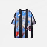 Back view of the blue Quirky Graphic Print T-Shirt in a gray background
