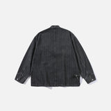 Back view of the black Relaxed Utility Wrap Jacket in a gray background