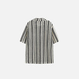 Back view of the black Vintage Striped Women's Shirt in a gray background