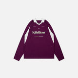Front view of the purple Nihilist Creed Polo Shirt in a gray background